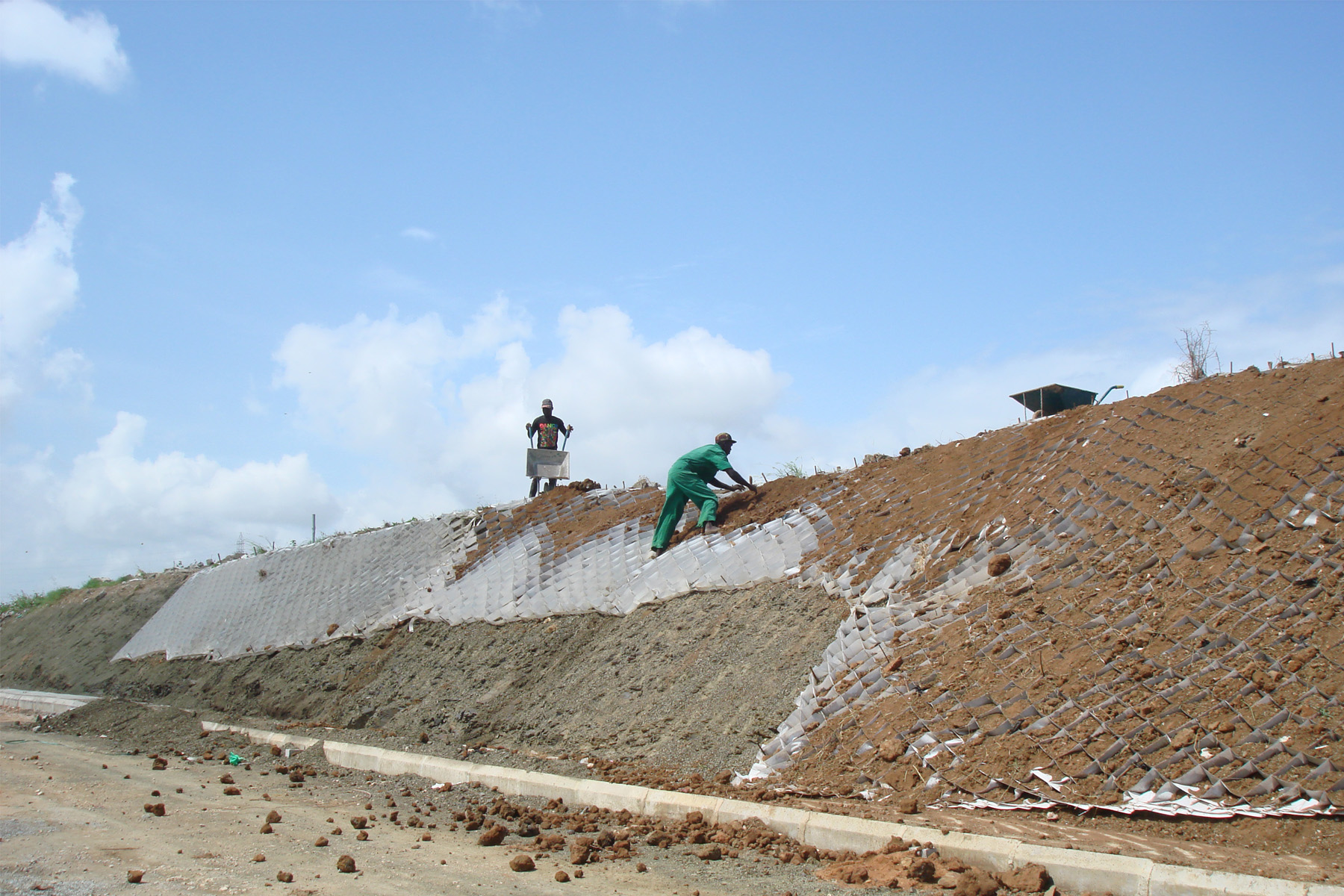 green cell geocells being installed on slope